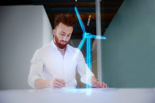 Unternehmensfoto Mann zeigt Hologram - Businessfotograf Businessfotografie Christian Vorhofer